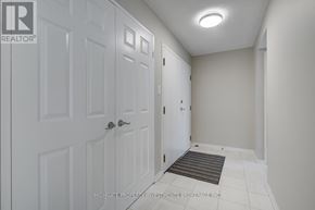 Toronto (Kensington-Chinatown) condo for rent - A white door with a silver handle is in a room with white walls.
