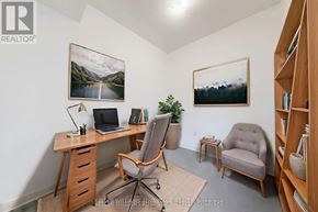Ajax (Central) townhouse for rent - A room with a desk, chair, and a painting on the wall.