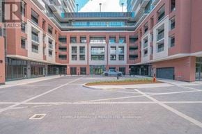 Toronto (Humber Heights) condo for rent - A large open courtyard surrounded by red brick buildings.