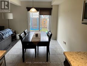 Hamilton (Stoney Creek Mountain) townhouse for rent - A dining room with a table and chairs is shown.