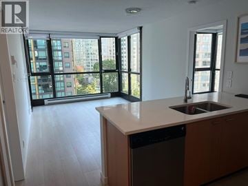 Vancouver apartment for rent - A kitchen with a dishwasher and a sink.