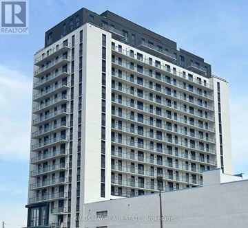 Brantford condo for rent - A tall building with many windows and balconies, with the words "KINGSWAY REAL ESTATE, Brokerage" on the side.