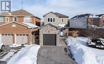Whitby (Pringle Creek) apartment for rent - A real estate photo of a house with a snow-covered driveway.
