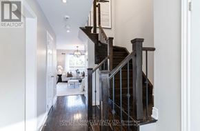 Whitby (Pringle Creek) apartment for rent - A spacious hallway with a staircase leading to the second floor.