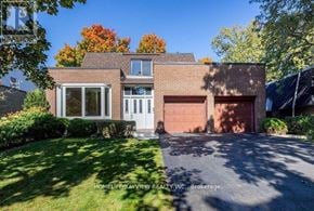Markham (Royal Orchard) apartment for rent - A house with a brick facade and a white door is for sale.