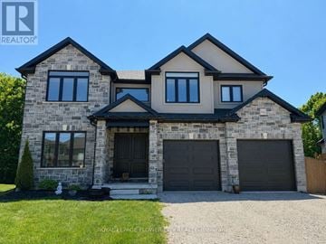 Woodstock (Woodstock - North) apartment for rent - A large house with a stone facade and two garages.