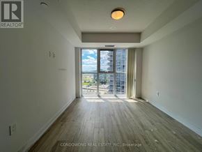 Toronto (Agincourt South-Malvern West) condo for rent - A room with a view of the city through a large window.