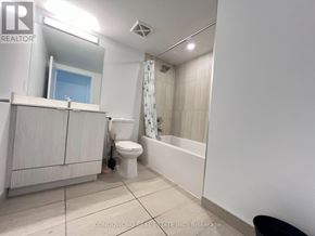 Toronto (Agincourt South-Malvern West) condo for rent - A white bathroom with a toilet, sink, and bathtub.