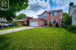 Lincoln (Beamsville) apartment for rent - A house with a green lawn and a car parked in front.
