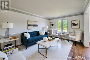 Lincoln (Beamsville) apartment for rent - A living room with a blue couch and a white coffee table.