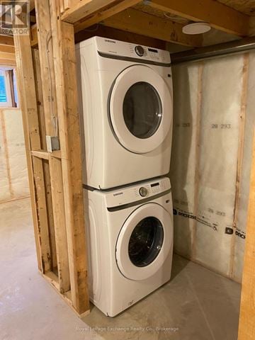 Hanover apartment for rent - Two white front load washing machines in a construction site.