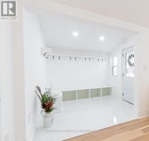 New Tecumseth (Tottenham) apartment for rent - A white room with a vase of flowers on a table.