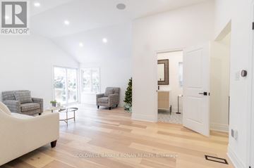 New Tecumseth (Tottenham) apartment for rent - A living room with a white couch and a coffee table.