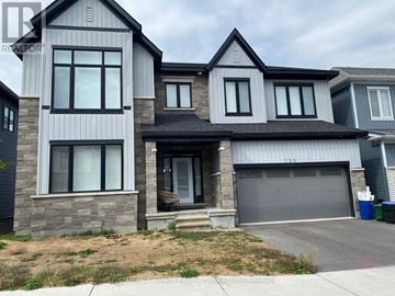 Ottawa apartment for rent - A modern two-story house with a garage is for sale.