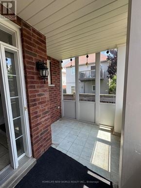 Oshawa (Pinecrest) apartment for rent - A balcony with a brick wall and a glass door.