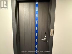 Oshawa (Windfields) condo for rent - A door with a tape that says "Tribute" on it.