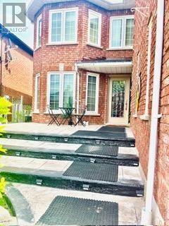 Mississauga (Meadowvale) apartment for rent - A brick house with a black and white striped ramp leading to the front door.