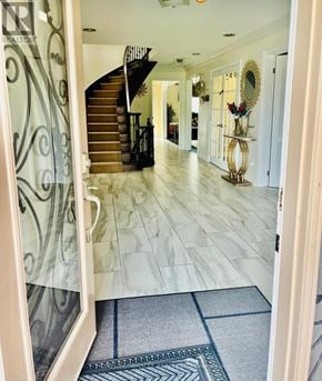 Mississauga (Meadowvale) apartment for rent - A hallway with a staircase and a mirror on the wall.