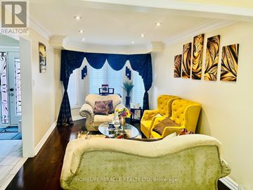Mississauga (Meadowvale) apartment for rent - A living room with a green sofa and a yellow chair.