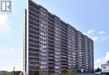 Toronto (Victoria Village) condo for rent - A tall residential building with multiple floors and balconies.