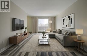 London apartment for rent - A living room with a grey couch, a coffee table, and a television.