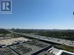 Toronto (Bayview Village) condo for rent - A realtor logo is on a picture of a parking lot.