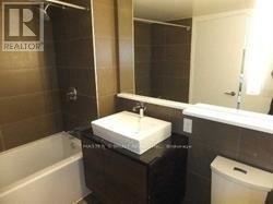 Toronto (Bayview Village) condo for rent - A bathroom with a white sink and a bathtub.