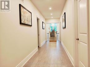 Richmond Hill (Observatory) apartment for rent - A hallway with a wooden floor and white walls, with a painting hanging on the wall.