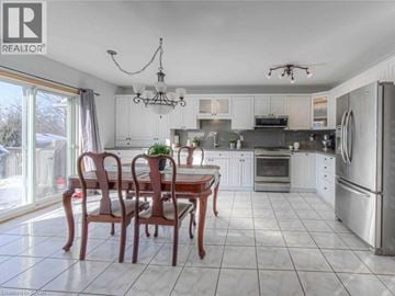 Cambridge apartment for rent - A well-lit kitchen with a dining table and chairs.