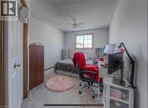 Cambridge apartment for rent - A bedroom with a bed, desk, and chair.