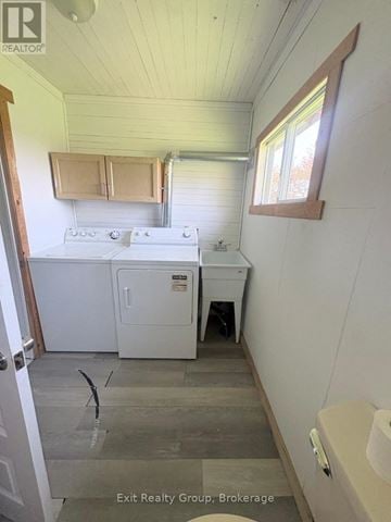 Prince Edward County (Hillier) apartment for rent - A small kitchen with a stove top oven and a sink.