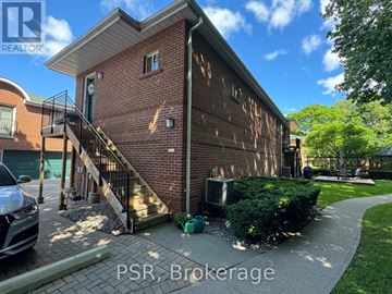 Toronto (Leaside) apartment for rent - A brick building with the words PSR Brokerage on the bottom.