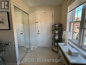 Toronto (Leaside) apartment for rent - A bathroom with a mirror, sink, and a plant on the windowsill.