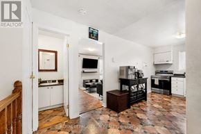Ottawa townhouse for rent - A kitchen with a tile floor and a white wall.