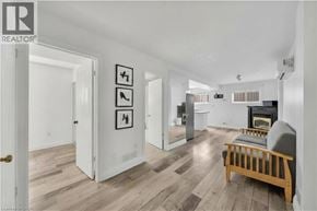 Kitchener apartment for rent - A living room with a fireplace and a couch.