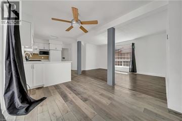 Kitchener apartment for rent - A modern kitchen with a hanging chair and a ceiling fan.