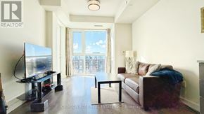 Oakville (Go Glenorchy) condo for rent - A living room with a flat screen TV and a couch.
