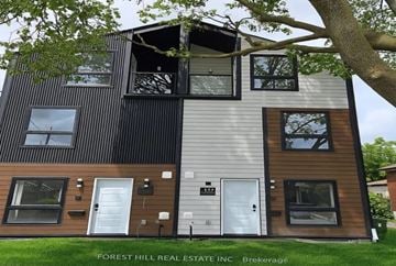 North York apartment for rent - A modern two-story house with a balcony on the second floor.