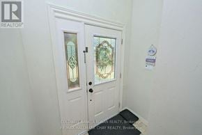 New Tecumseth (Alliston) apartment for rent - A white door with a glass window and a handle.