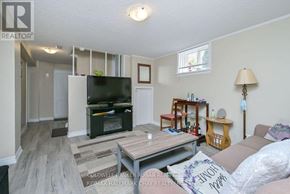 New Tecumseth (Alliston) apartment for rent - A living room with a TV, a couch, and a coffee table.