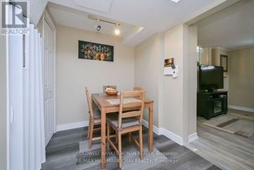 New Tecumseth (Alliston) apartment for rent - A dining room with a wooden table and chairs.
