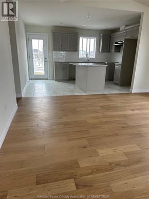 Lakeshore apartment for rent - A kitchen with wooden floors and a countertop.