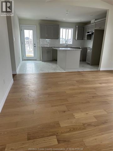 Lakeshore apartment for rent - A kitchen with wooden floors and a countertop.