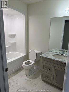 Lakeshore apartment for rent - A white toilet in a bathroom with a marble counter top.