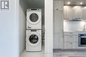 Toronto (Dovercourt-Wallace Emerson-Junction) condo for rent - A white washing machine and dryer in a laundry room.