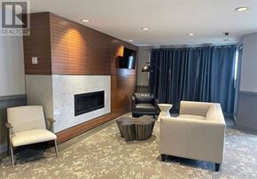 London North (North G) condo for rent - A living room with a fireplace and a chair.
