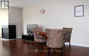 London North (North G) condo for rent - A living room with a flat screen TV and two chairs.