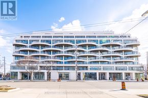 Toronto (Stonegate-Queensway) condo for rent - A large white building with many windows and balconies is the focus of this image.