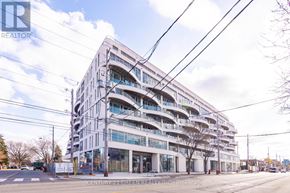 Toronto (Stonegate-Queensway) condo for rent - A modern multi-story building with glass windows and balconies.