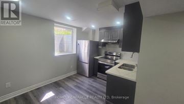 Brampton (Northwest Brampton) apartment for rent - A kitchen with a sink, stove, and refrigerator.